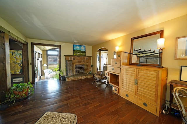 office with plenty of natural light and dark hardwood / wood-style flooring