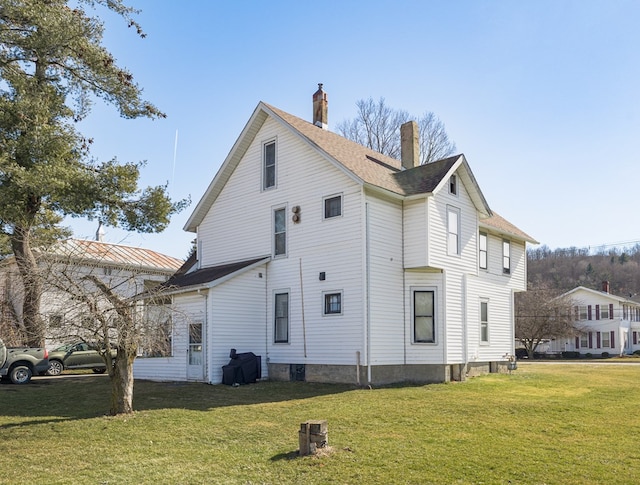 view of home's exterior with a lawn