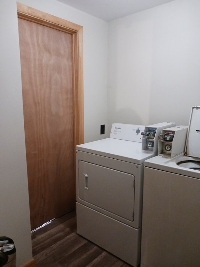 laundry area with dark hardwood / wood-style flooring and separate washer and dryer