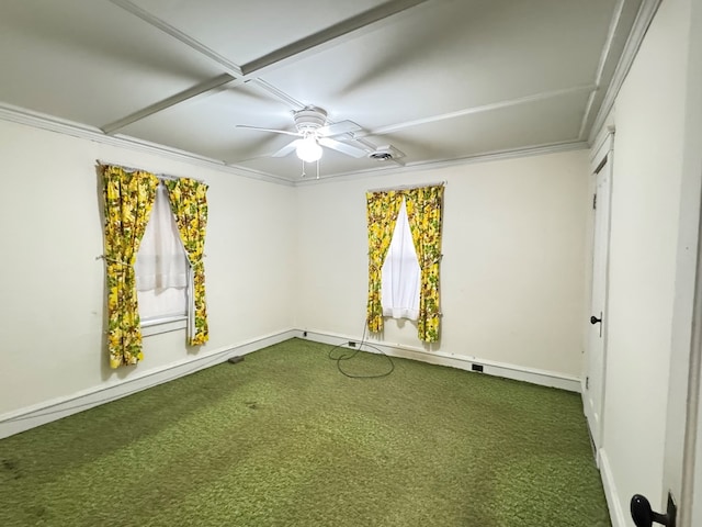 carpeted spare room with a wealth of natural light, ceiling fan, ornamental molding, and baseboards