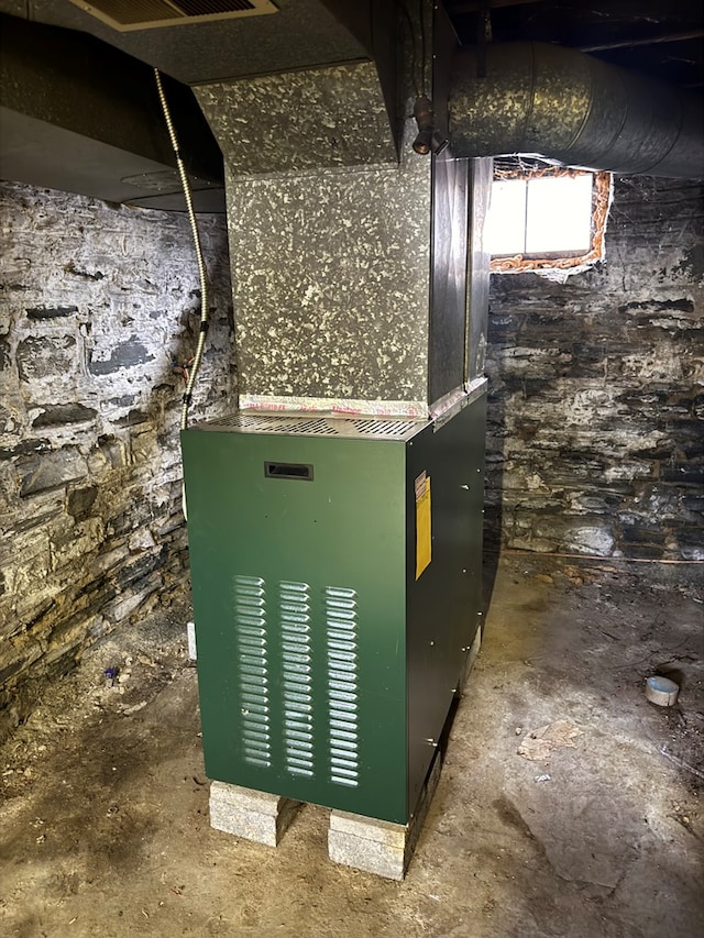 utility room with heating unit