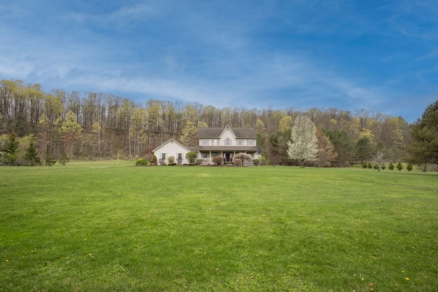 view of yard with a wooded view