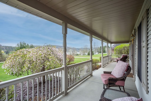 balcony with a porch and a mountain view