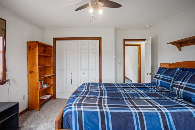 carpeted bedroom featuring a closet, ceiling fan, and baseboards