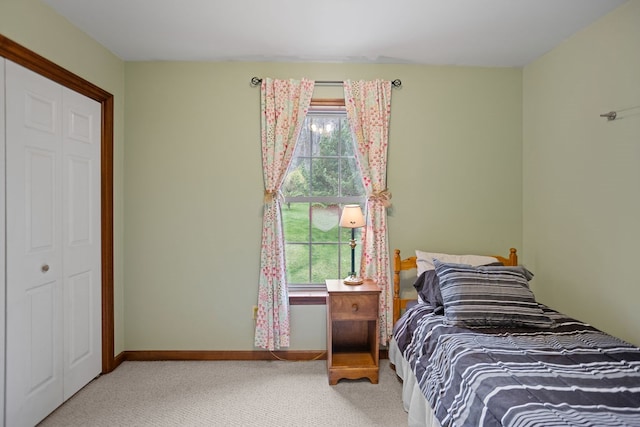 carpeted bedroom with baseboards