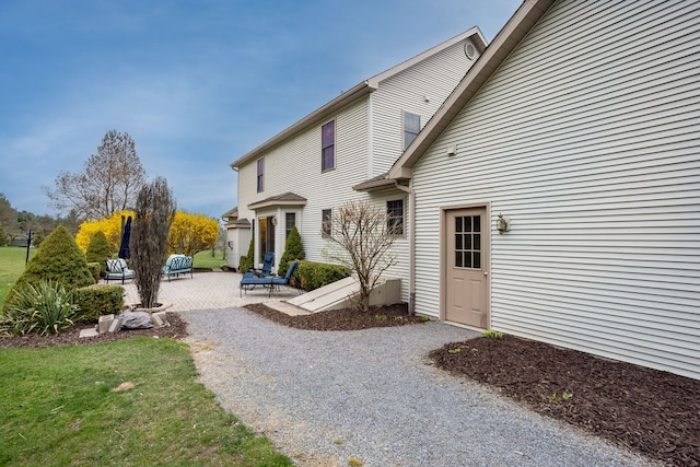 rear view of property with a patio area
