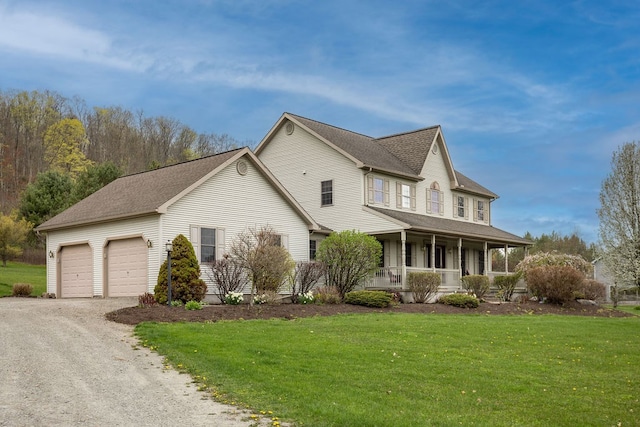 view of front of house featuring covered porch, dirt driveway, a front lawn, and an attached garage