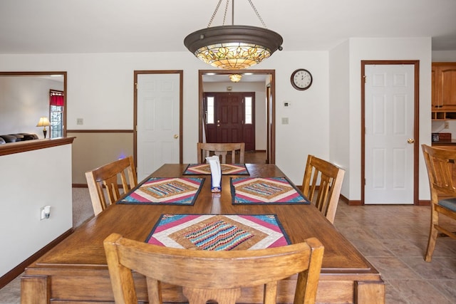 dining room featuring baseboards
