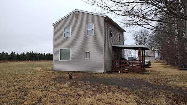 view of home's exterior with a yard