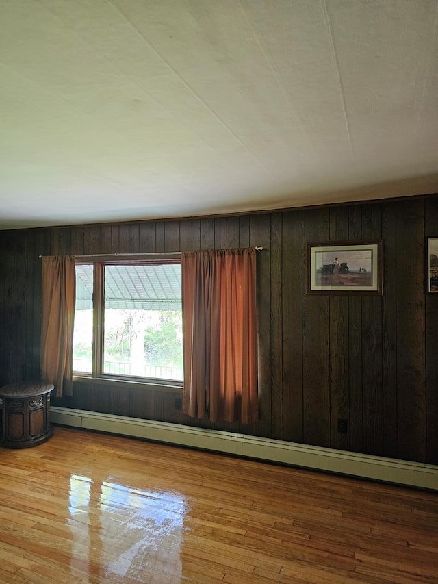 71 Kendrick Rd, Covington, PA 16917 - unfurnished room with wooden walls, wood finished floors, and baseboard heating