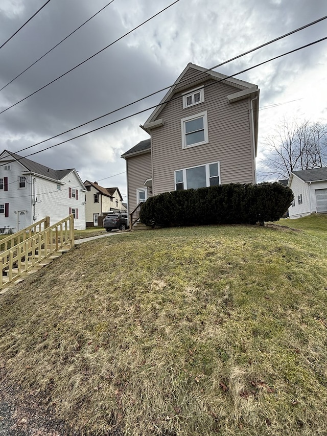 view of property exterior featuring a yard