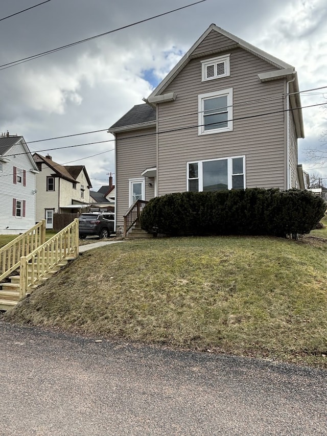 view of property with a front lawn