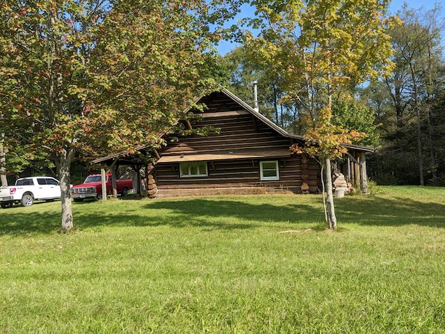 view of property exterior with a yard