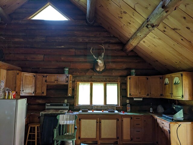480 Bowers Rd, Coudersport, PA 16915 - kitchen with rustic walls, freestanding refrigerator, range, and wooden ceiling