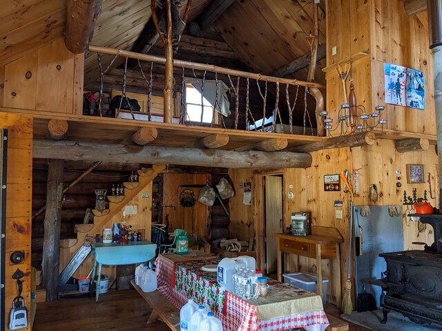 480 Bowers Rd, Coudersport, PA 16915 - miscellaneous room with high vaulted ceiling, hardwood / wood-style floors, wood walls, stairway, and a wooden ceiling with exposed beams