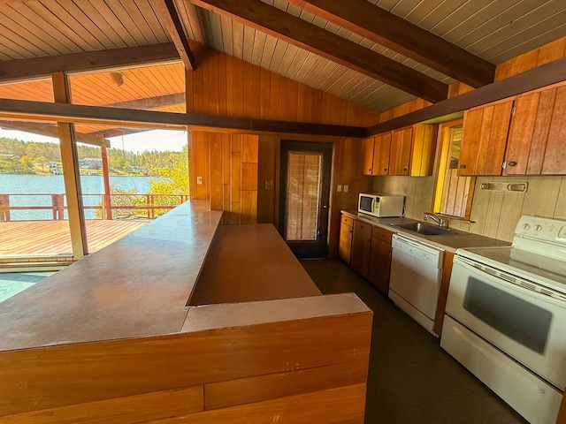 986 Wesauking Dr, Towanda, PA 18848 - kitchen featuring white appliances, a sink, brown cabinets, a water view, and wooden walls
