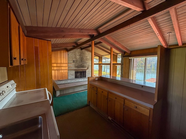 986 Wesauking Dr, Towanda, PA 18848 - kitchen with range, wood walls, wooden ceiling, a stone fireplace, and carpet