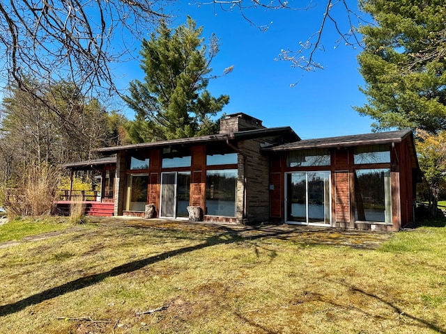 986 Wesauking Dr, Towanda, PA 18848 - back of property featuring a lawn and a chimney