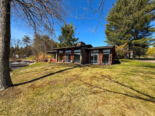 986 Wesauking Dr, Towanda, PA 18848 - back of property featuring a yard and a chimney