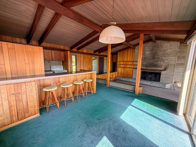 986 Wesauking Dr, Towanda, PA 18848 - kitchen featuring carpet, electric range, a stone fireplace, open floor plan, and a breakfast bar area