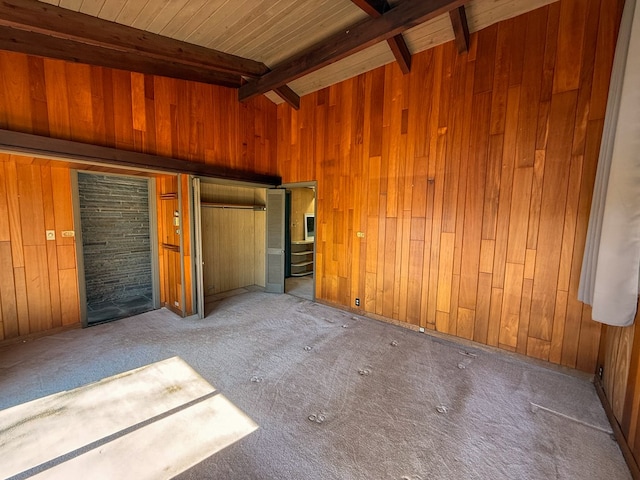 986 Wesauking Dr, Towanda, PA 18848 - unfurnished bedroom featuring wood walls, beam ceiling, and carpet flooring