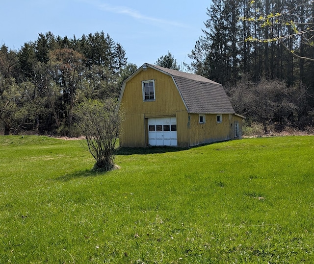 1057 Stony Fork Rd, Wellsboro, PA 16901 - exterior space featuring a barn, a detached garage, an outdoor structure, a gambrel roof, and a yard