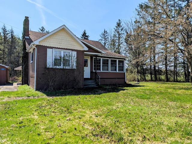1057 Stony Fork Rd, Wellsboro, PA 16901 - bungalow-style home featuring a front yard, a chimney, a shingled roof, and entry steps