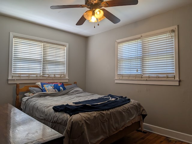 1057 Stony Fork Rd, Wellsboro, PA 16901 - bedroom with baseboards, ceiling fan, wood finished floors, and multiple windows