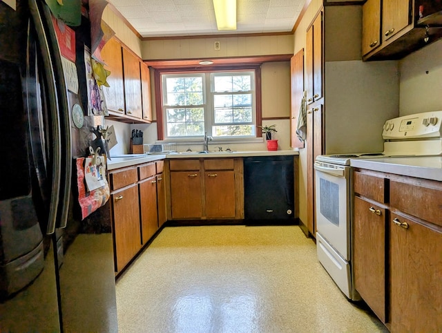 1057 Stony Fork Rd, Wellsboro, PA 16901 - kitchen featuring a sink, light countertops, brown cabinetry, and black appliances