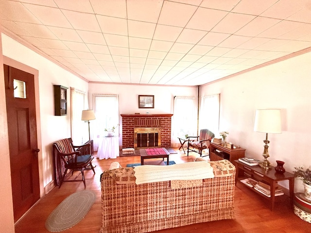 10598 Leetonia Rd, Gaines, PA 16921 - living area featuring a brick fireplace, crown molding, and wood finished floors
