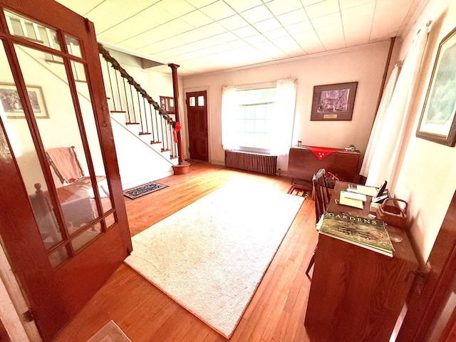10598 Leetonia Rd, Gaines, PA 16921 - entrance foyer featuring radiator, hardwood / wood-style flooring, and stairs