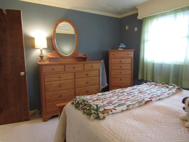 bedroom featuring ornamental molding and light carpet