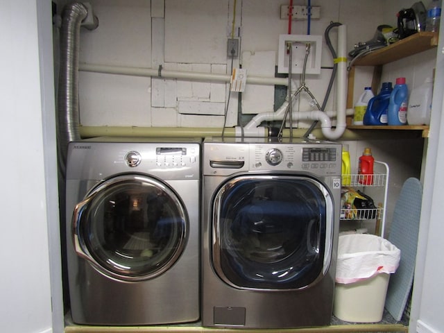 clothes washing area featuring washing machine and clothes dryer