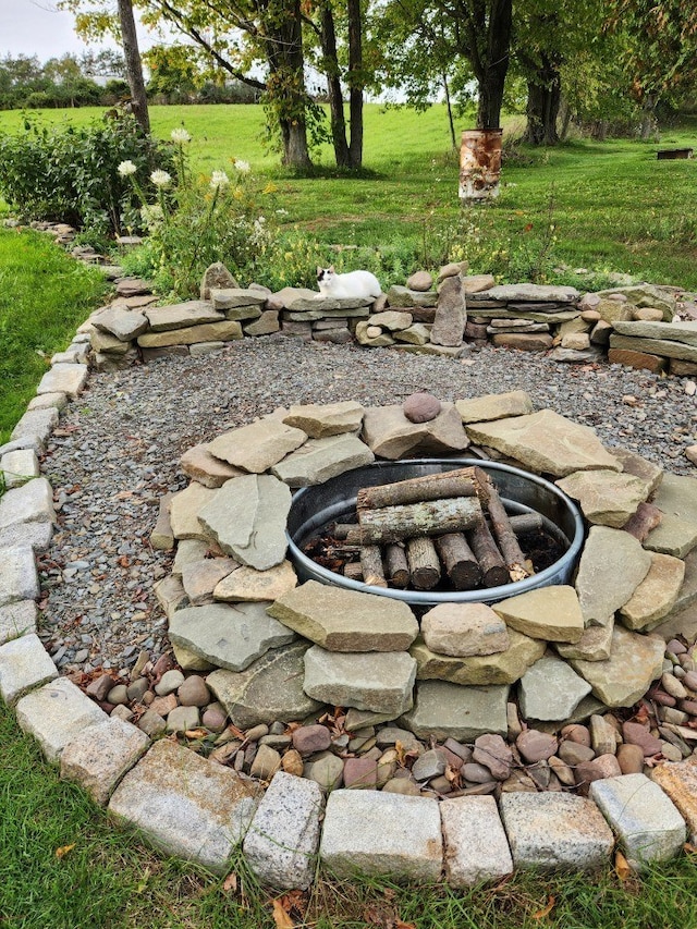 view of yard with an outdoor fire pit