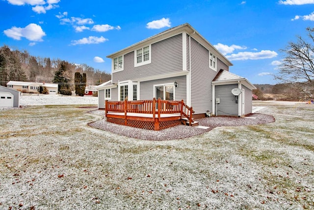 rear view of house featuring a wooden deck