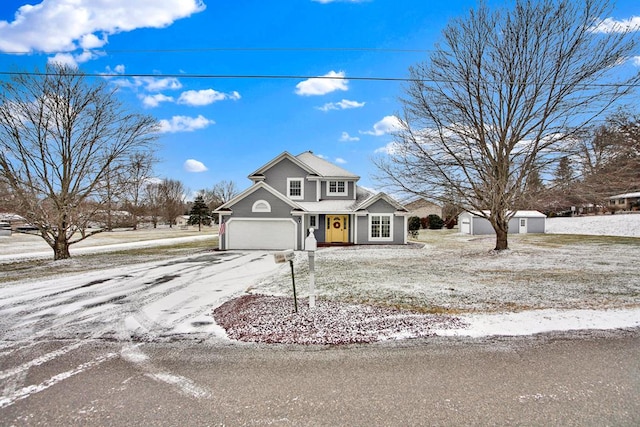 front of property featuring a storage unit and a garage