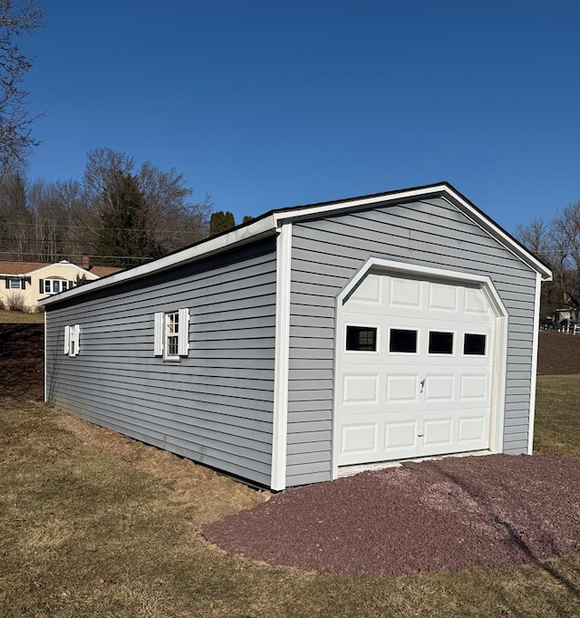 rear view of house with an outbuilding and a deck