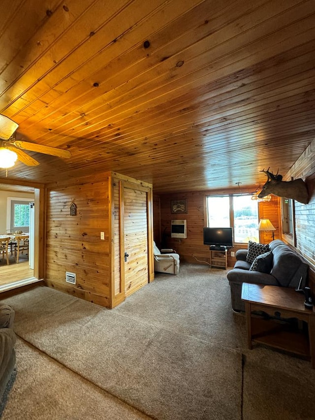 living room with plenty of natural light, wooden walls, and wood ceiling