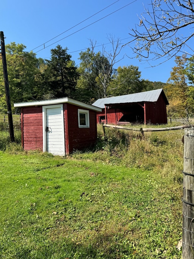 view of outbuilding with a yard