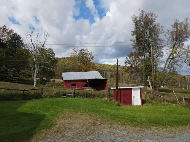 view of outbuilding featuring a lawn