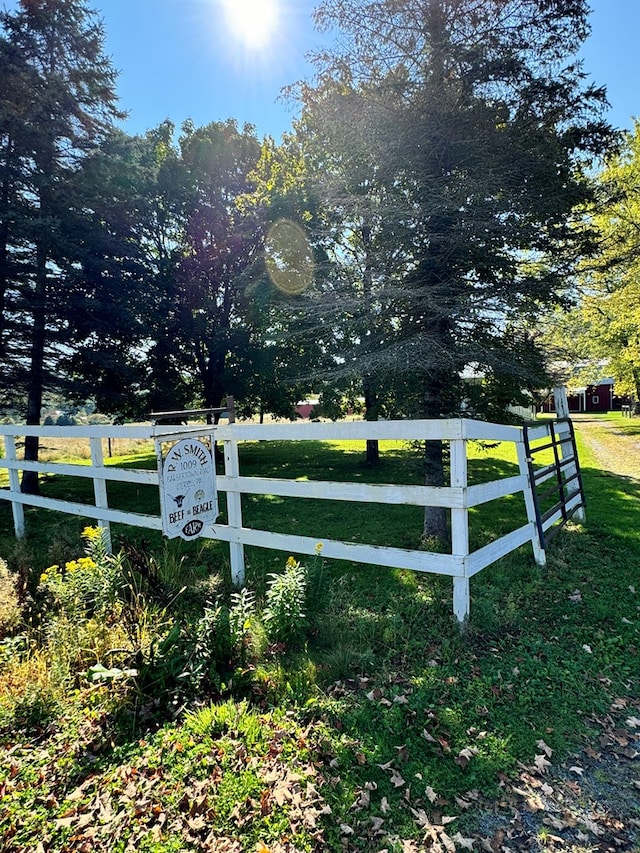 view of gate featuring a yard