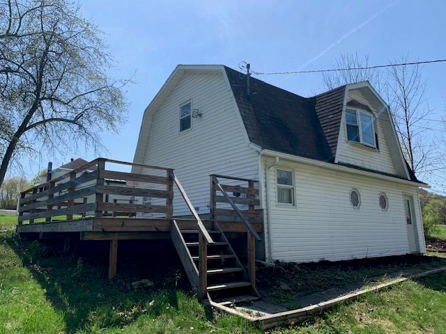 rear view of property with a deck