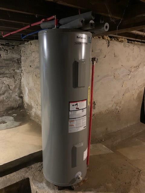 utility room featuring electric water heater