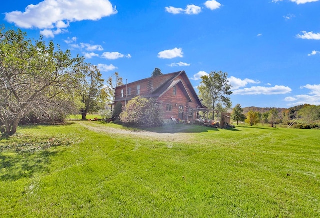 view of home's exterior featuring a yard