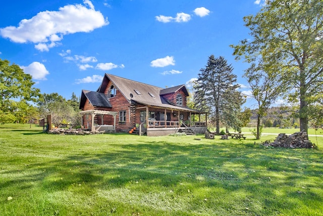 view of side of property featuring a yard and covered porch