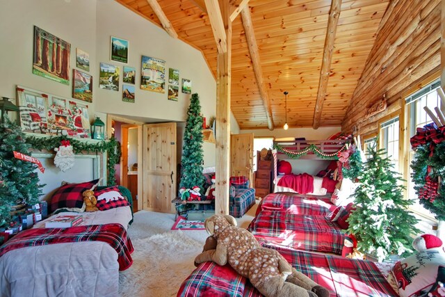 bedroom with carpet flooring, beam ceiling, wooden ceiling, and high vaulted ceiling