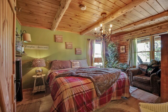 bedroom featuring beamed ceiling, a notable chandelier, wood ceiling, and multiple windows