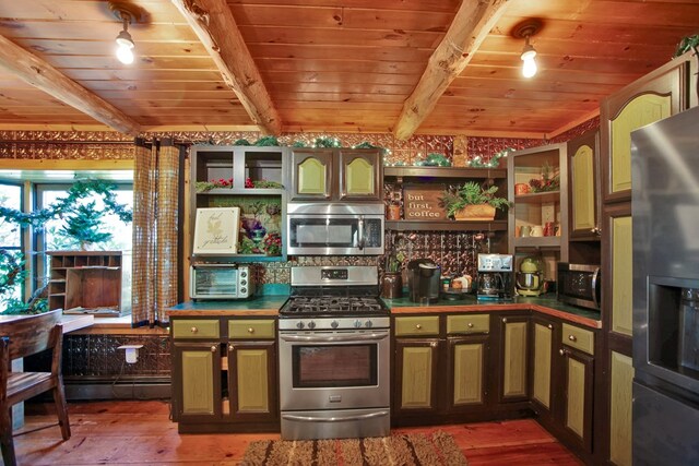 kitchen featuring beam ceiling, wood-type flooring, wooden ceiling, and appliances with stainless steel finishes