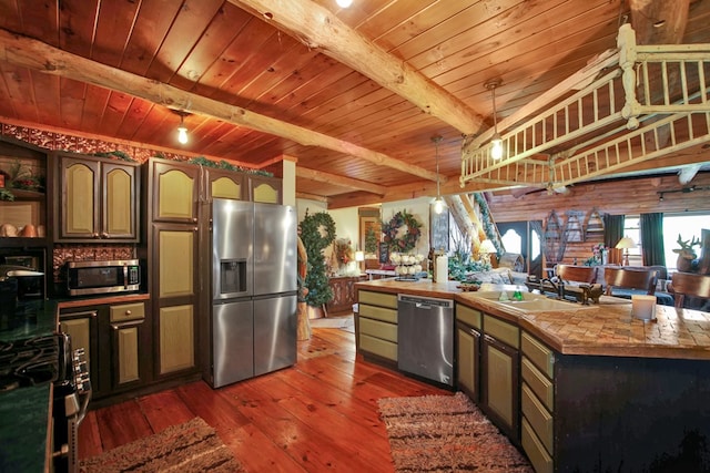 kitchen with dark brown cabinetry, sink, stainless steel appliances, beamed ceiling, and dark hardwood / wood-style floors