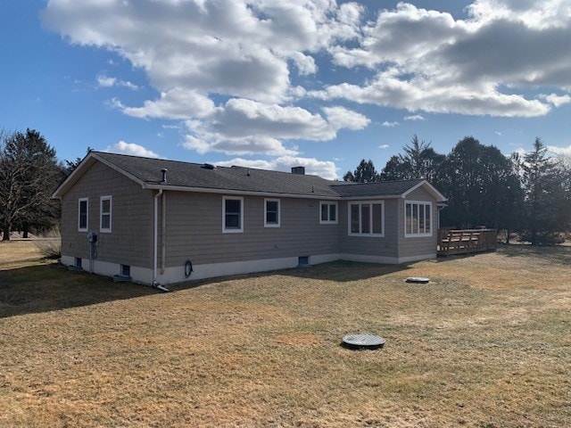 back of house featuring a yard